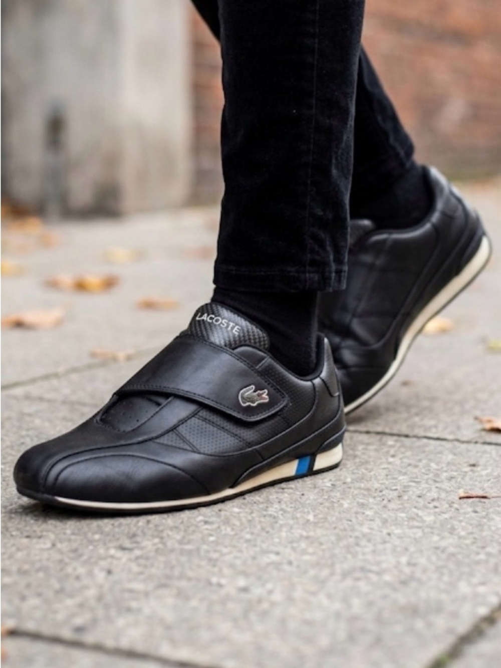 Lacoste Black Slip-On Sneakers with Blue and White Trim